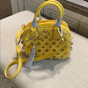 Yellow studded handbag
